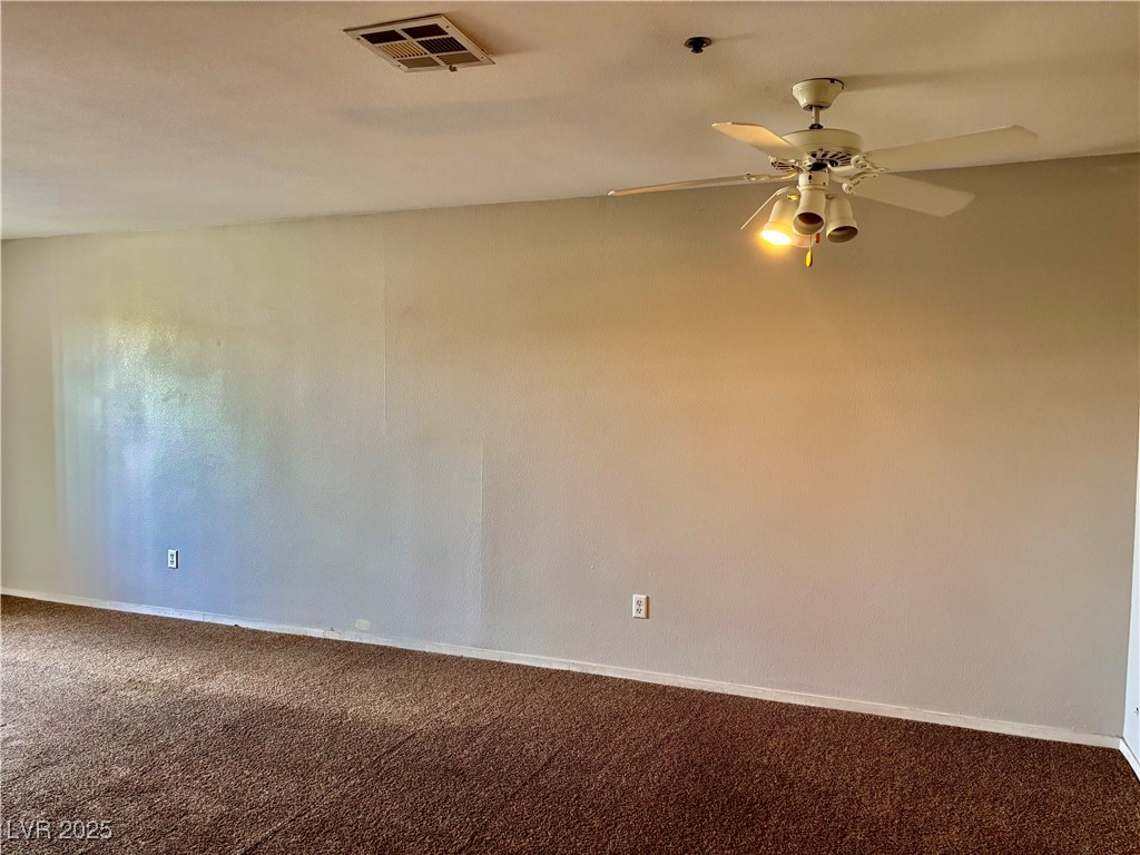 2011 Cutlass Drive Henderson, NV 89014 - Photo 21 of 41 Spare room featuring carpet flooring and ceiling fan