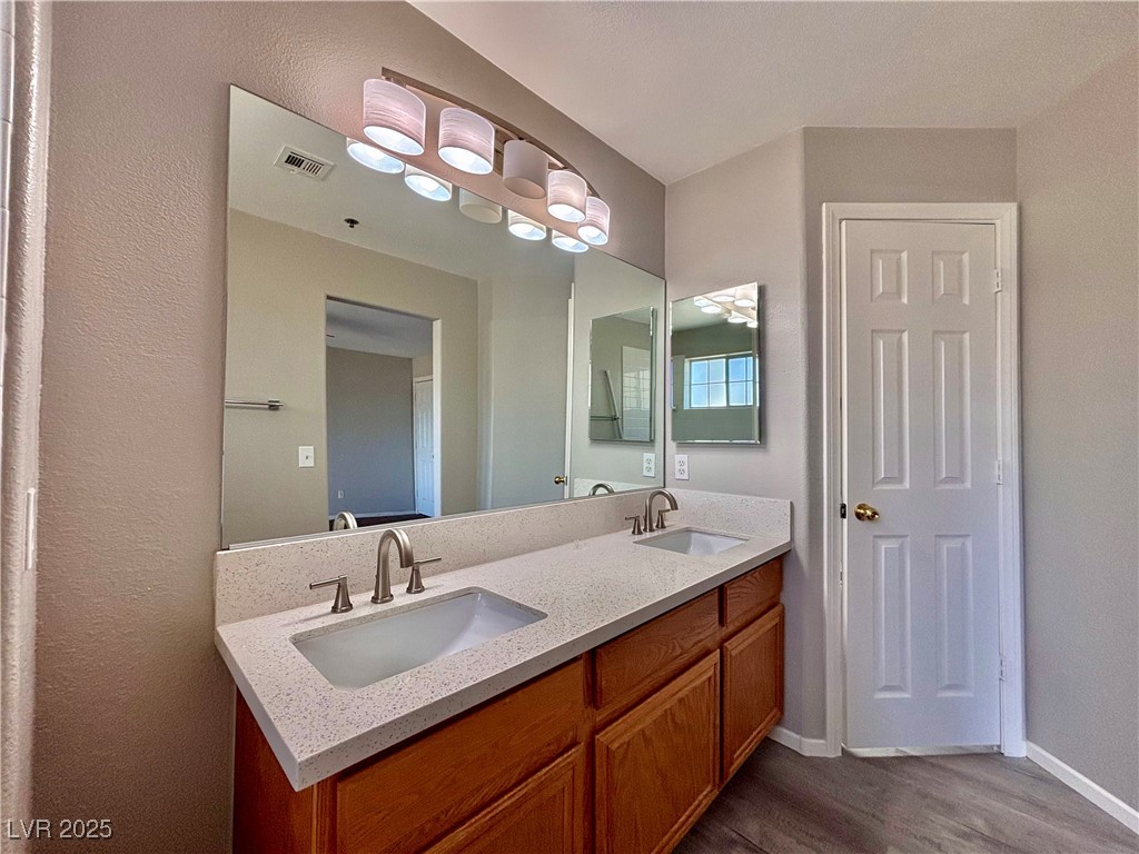 2011 Cutlass Drive Henderson, NV 89014 - Photo 26 of 41 Full bath with double vanity and wood finished floors