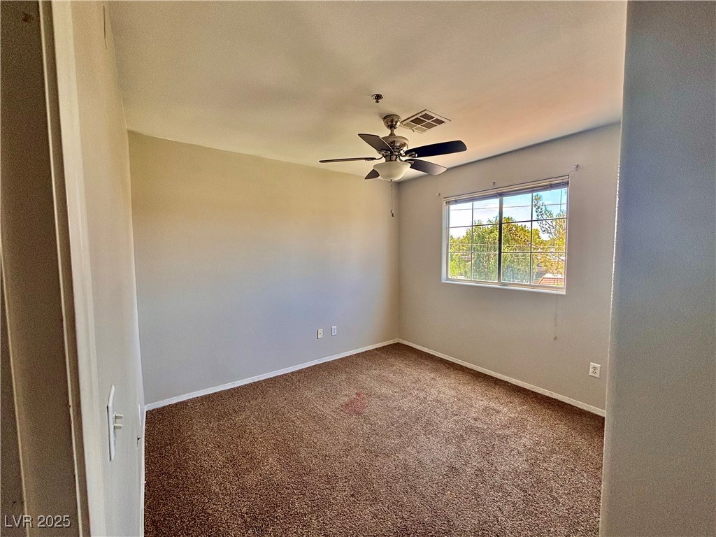 2011 Cutlass Drive Henderson, NV 89014 - Photo 32 of 41 Carpeted empty room featuring a ceiling fan and baseboards