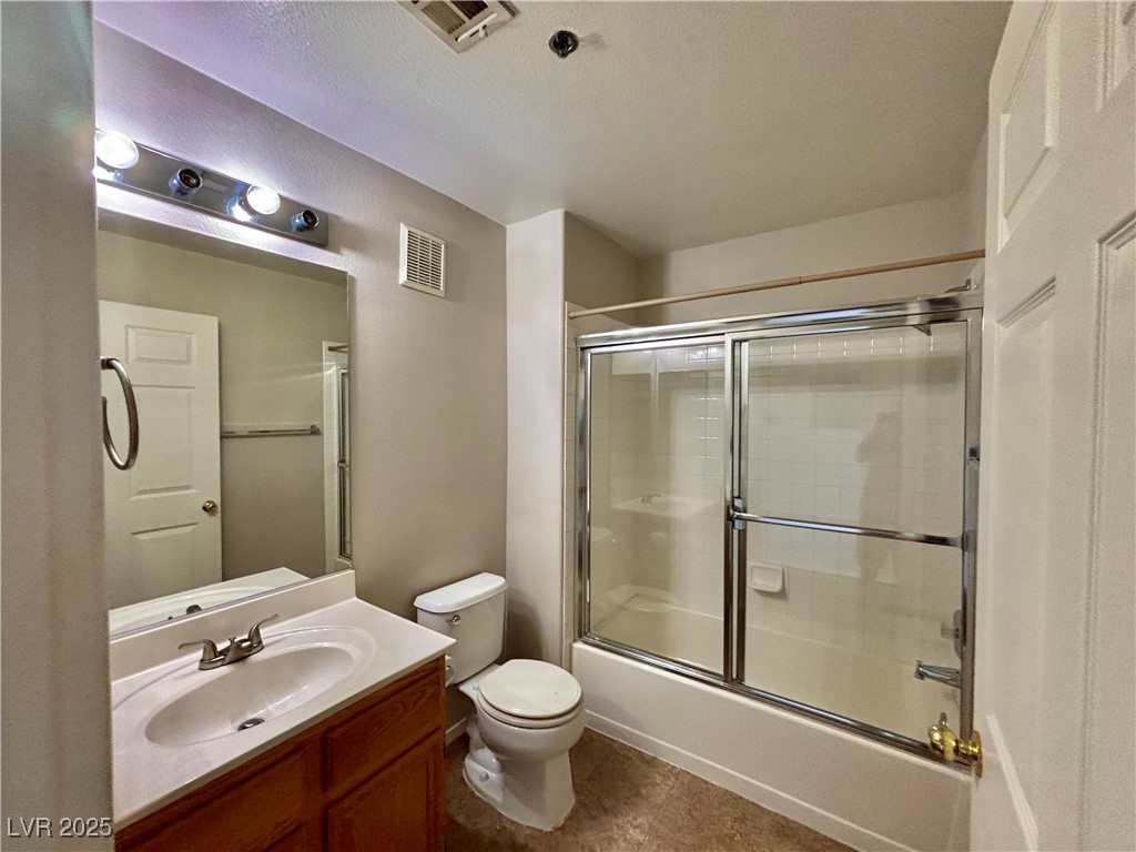 2011 Cutlass Drive Henderson, NV 89014 - Photo 37 of 41 Full bathroom with vanity and bath / shower combo with glass door