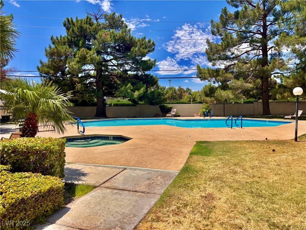 2011 Cutlass Drive Henderson, NV 89014 - Photo 6 of 41 Community pool featuring a hot tub and a patio