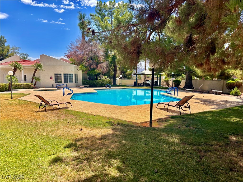 2011 Cutlass Drive Henderson, NV 89014 - Photo 9 of 41 Outdoor pool with a patio and a yard