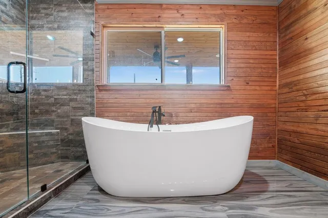 a white bath tub sitting in a bathroom