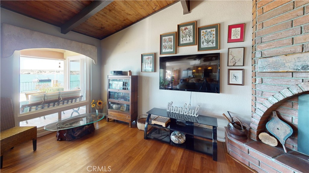 26576 Bluewater Road Helendale, CA 92342 - Photo 12 of 51 a living room with furniture and a flat screen tv