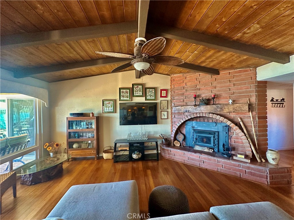 26576 Bluewater Road Helendale, CA 92342 - Photo 13 of 51 a living room with furniture and a fireplace