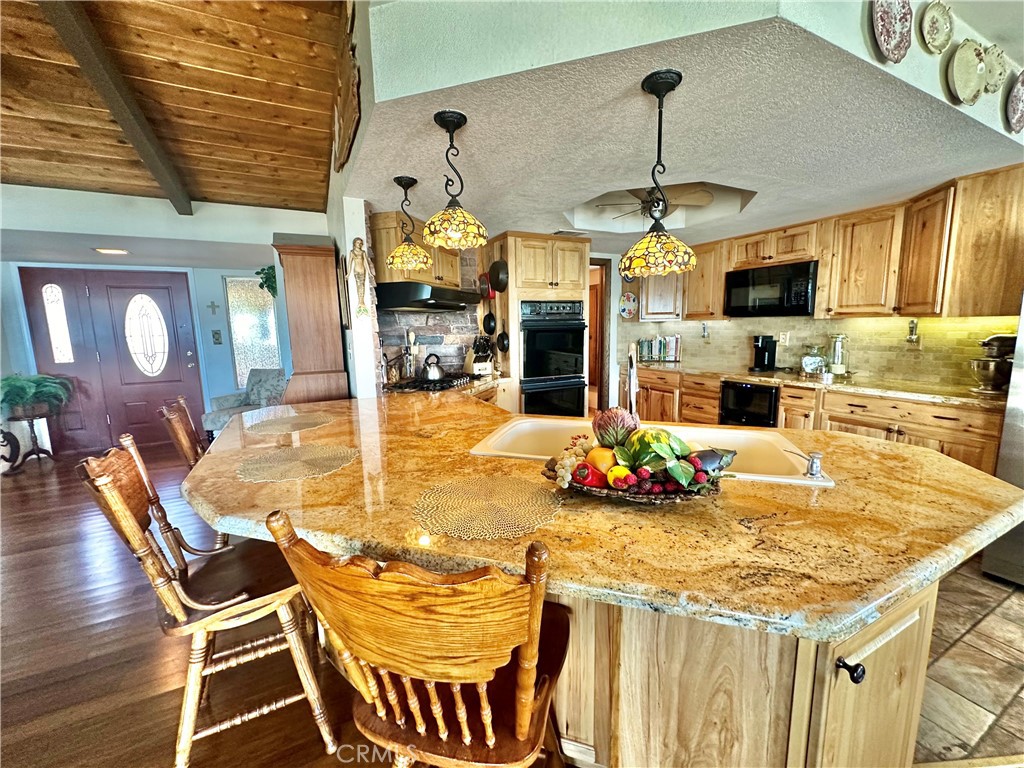 26576 Bluewater Road Helendale, CA 92342 - Photo 15 of 51 a dining table with chairs and window