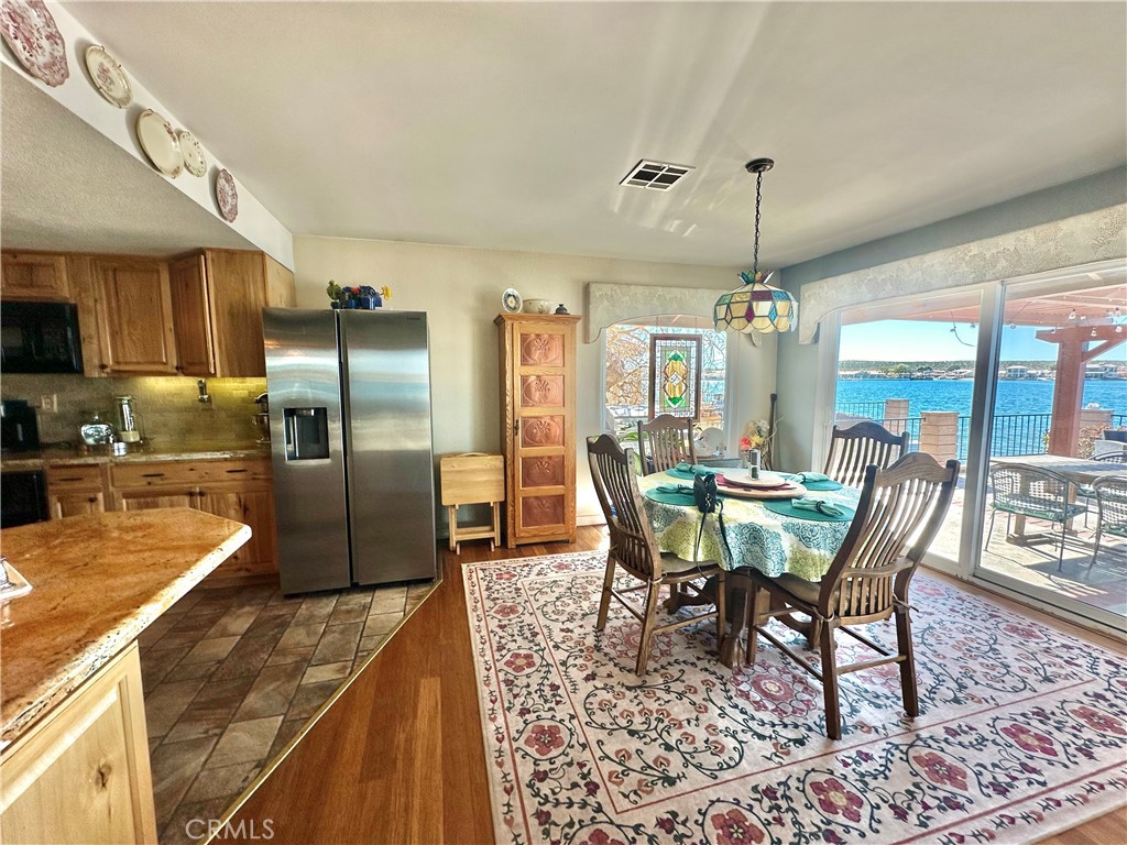 26576 Bluewater Road Helendale, CA 92342 - Photo 19 of 51 a view of a dining room with furniture window and wooden floor