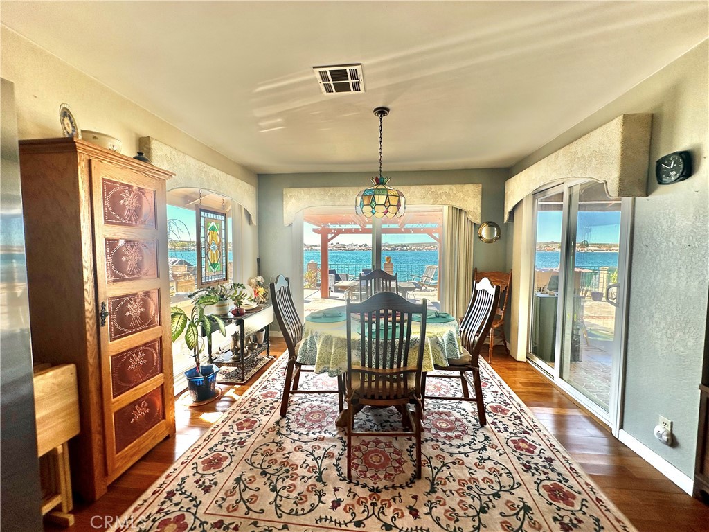 26576 Bluewater Road Helendale, CA 92342 - Photo 20 of 51 a view of a dining room with furniture window and wooden floor