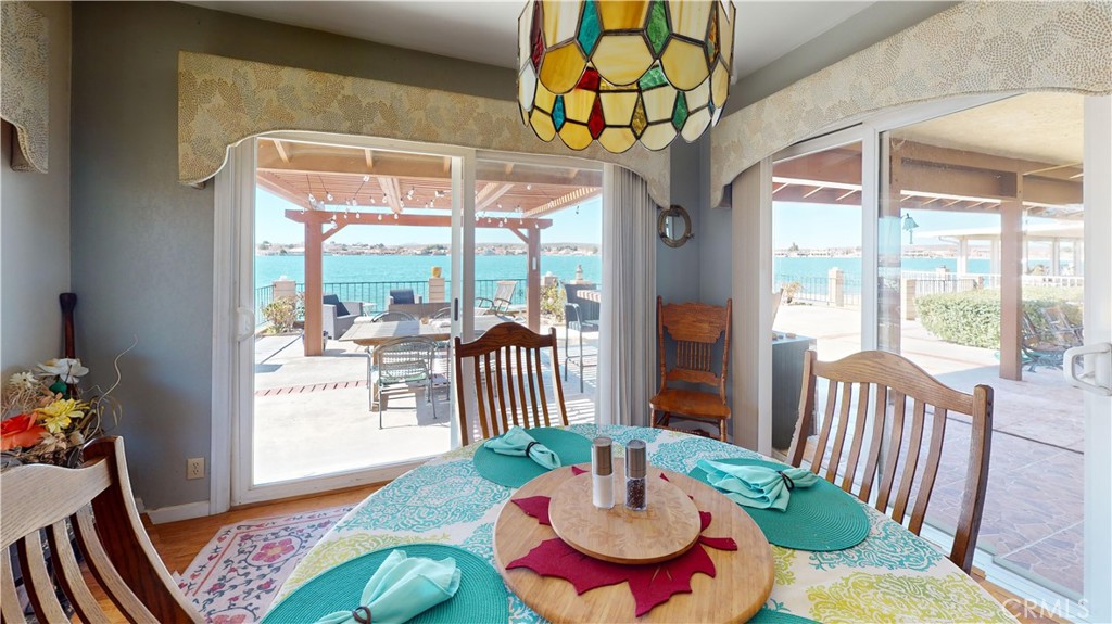 26576 Bluewater Road Helendale, CA 92342 - Photo 21 of 51 a dining room with furniture a rug and wooden floor
