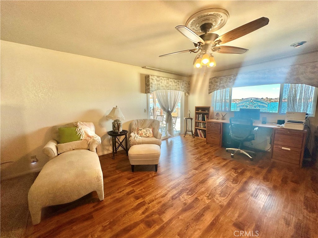 26576 Bluewater Road Helendale, CA 92342 - Photo 28 of 51 a living room with furniture and a chandelier