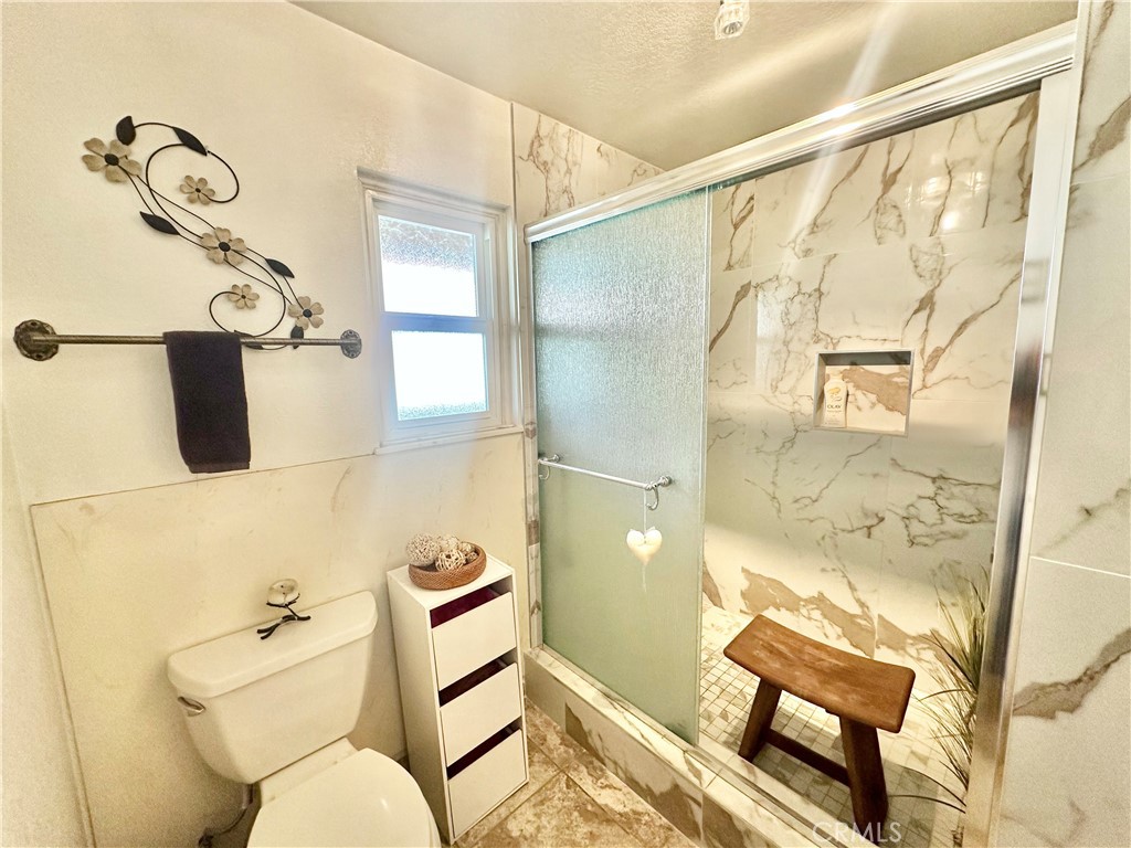 26576 Bluewater Road Helendale, CA 92342 - Photo 31 of 51 a bathroom with a toilet sink and shower