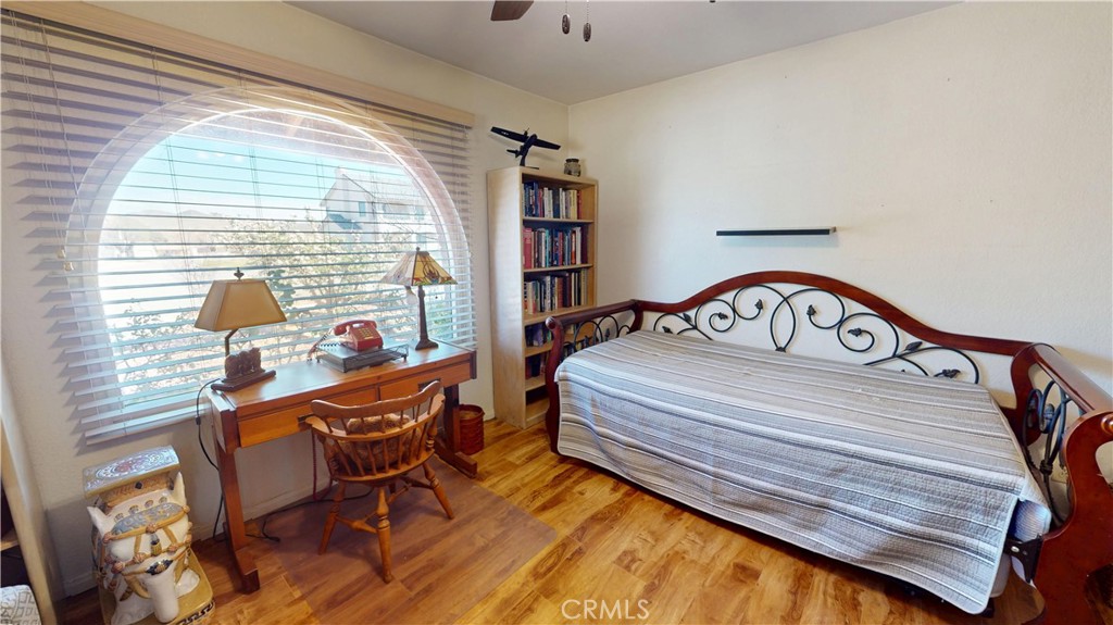 26576 Bluewater Road Helendale, CA 92342 - Photo 34 of 51 a bedroom with a bed next to a window