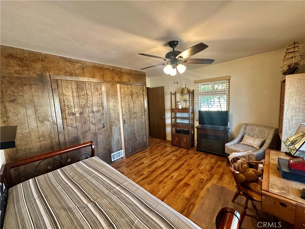 26576 Bluewater Road Helendale, CA 92342 - Photo 36 of 51 a bedroom with a bed and wooden floor