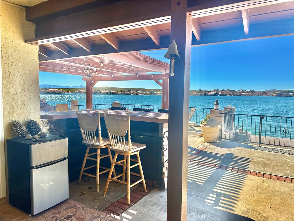 26576 Bluewater Road Helendale, CA 92342 - Photo 39 of 51 a view of a balcony with table and chairs
