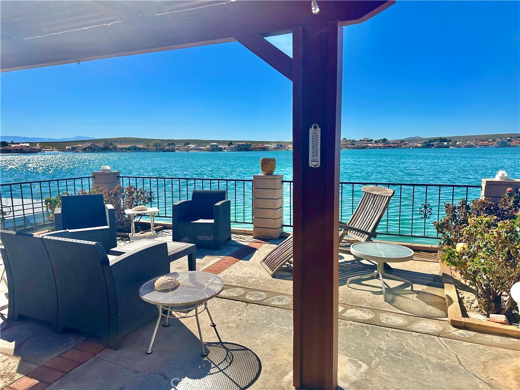 26576 Bluewater Road Helendale, CA 92342 - Photo 44 of 51 a view of a balcony with chair and table
