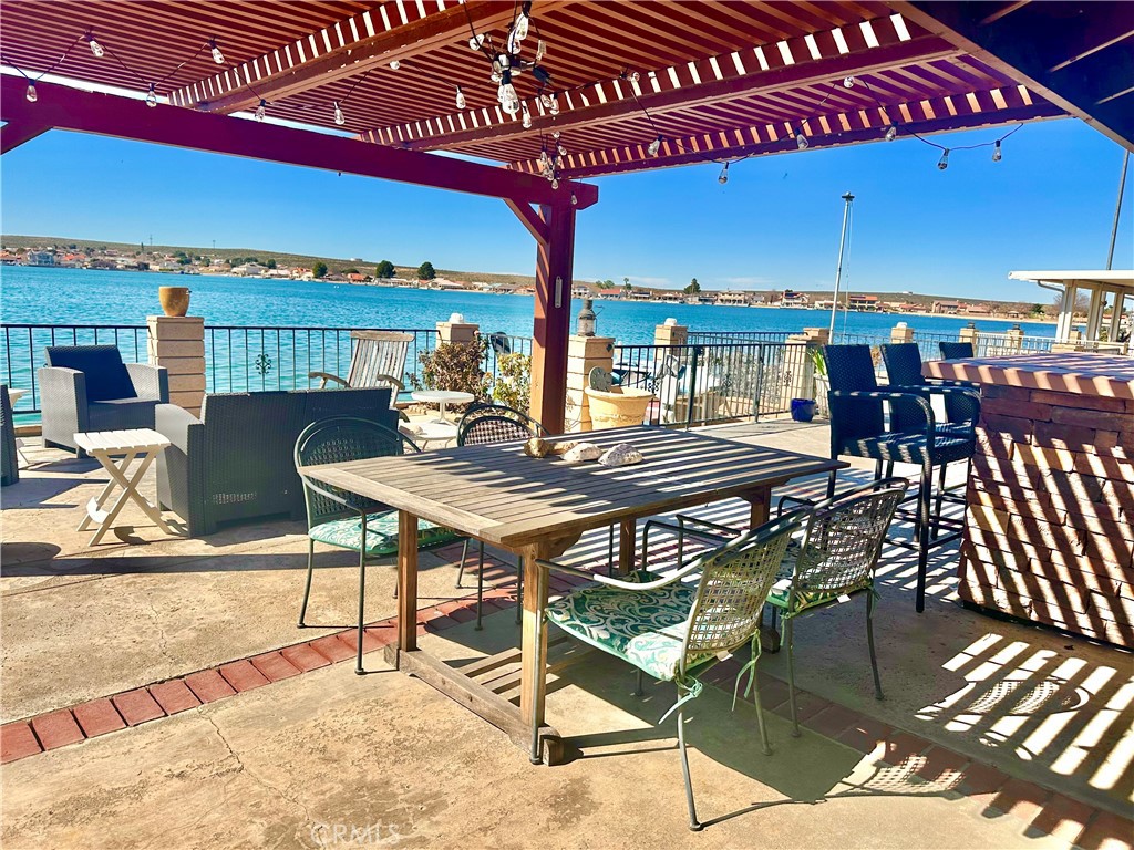 26576 Bluewater Road Helendale, CA 92342 - Photo 45 of 51 a view of a dinning tables and chairs in patio