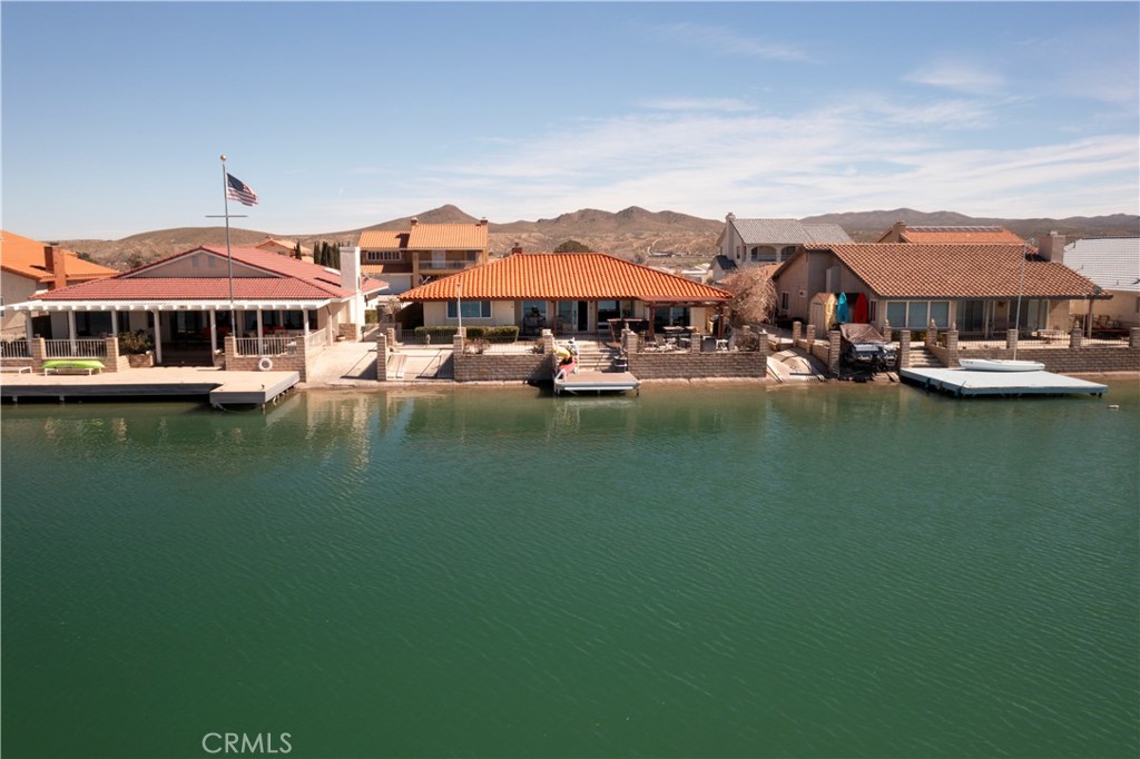 26576 Bluewater Road Helendale, CA 92342 - Photo 50 of 51 a view of a lake with a house in the background