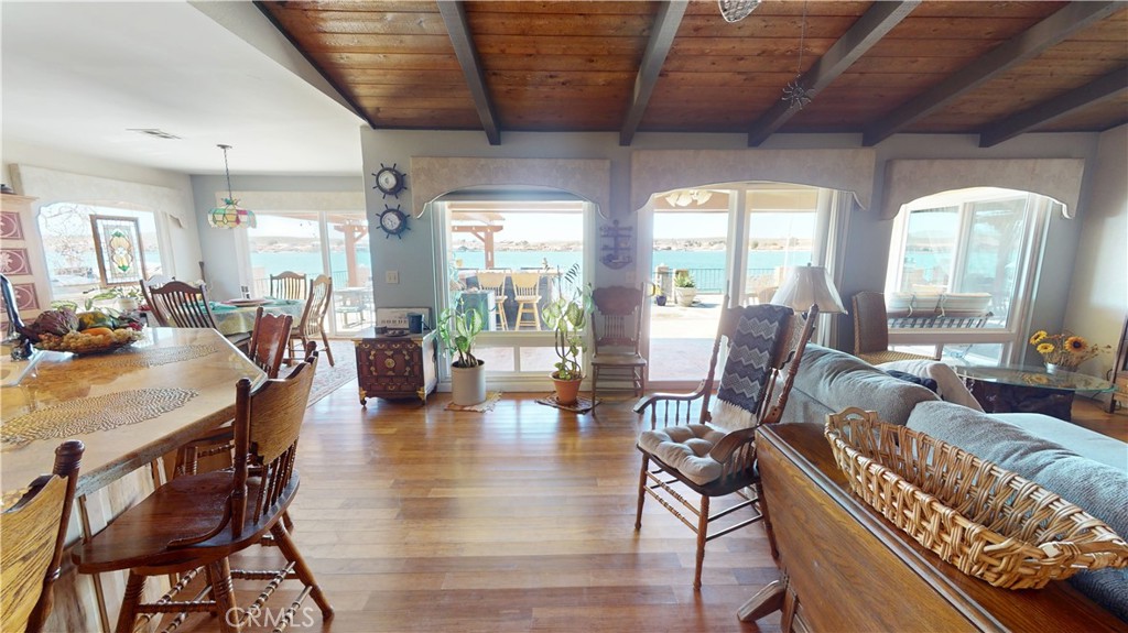 26576 Bluewater Road Helendale, CA 92342 - Photo 10 of 51 a view of a dining room with furniture window and wooden floor