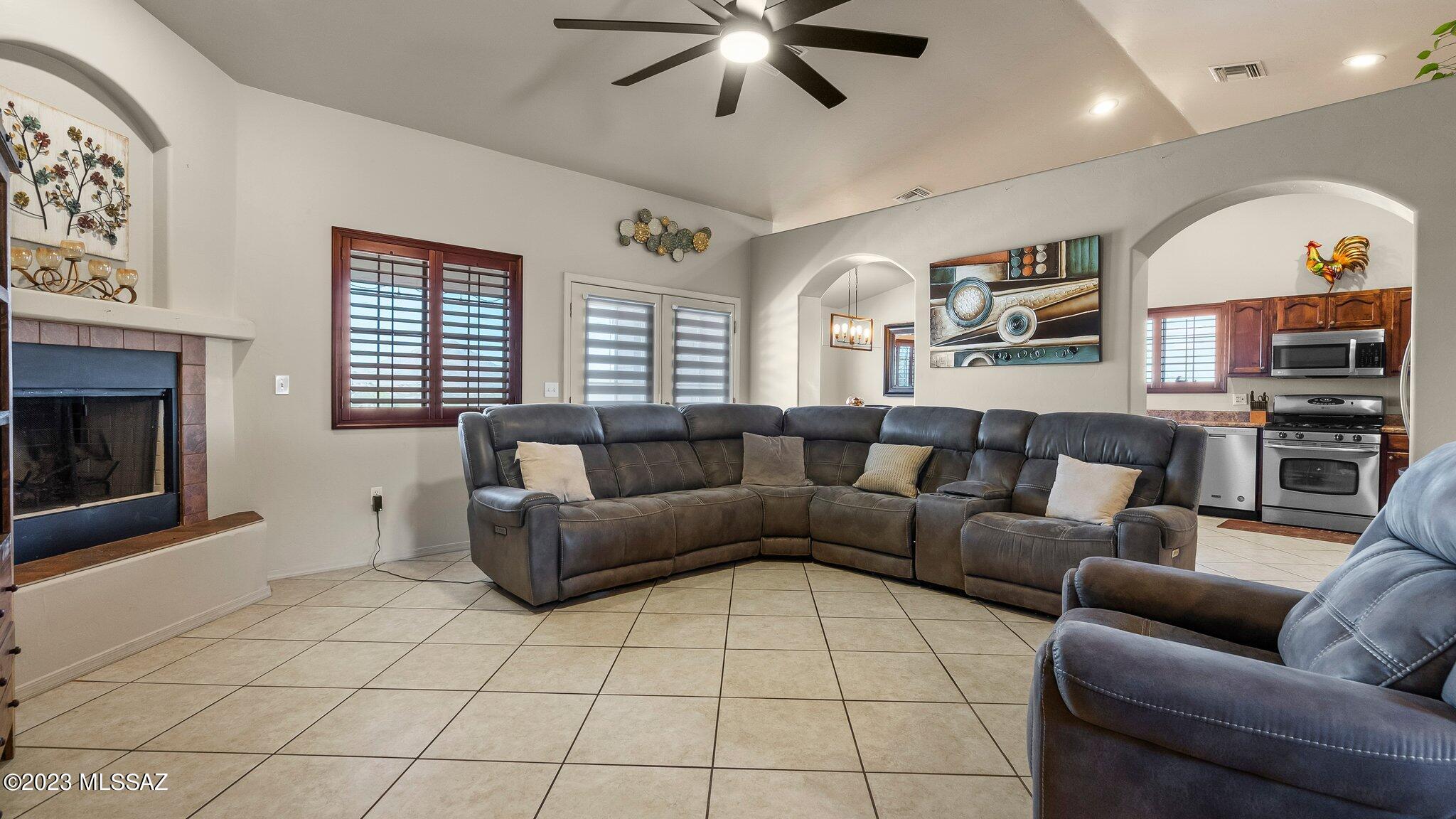 96 Calle Quintana Rio Rico, AZ 85648 - Photo 11 of 30 a living room with furniture and a fireplace