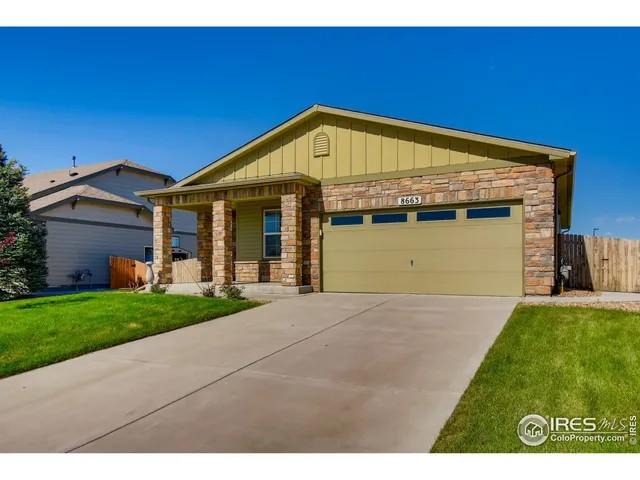 a view of an house with backyard space and garden