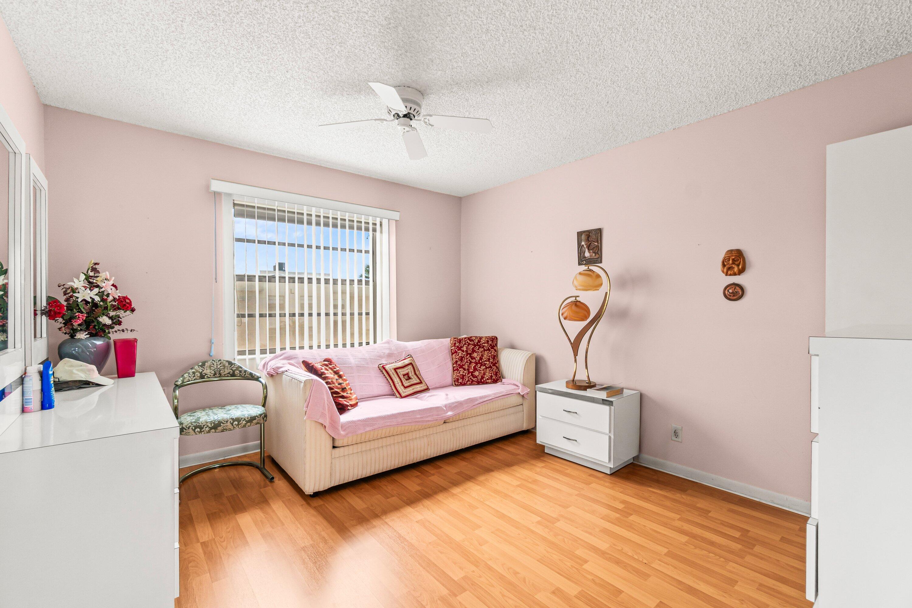 508 Normandy Lane, Unit 508 Delray Beach, FL 33484 - Photo 19 of 25 a living room with furniture and a window