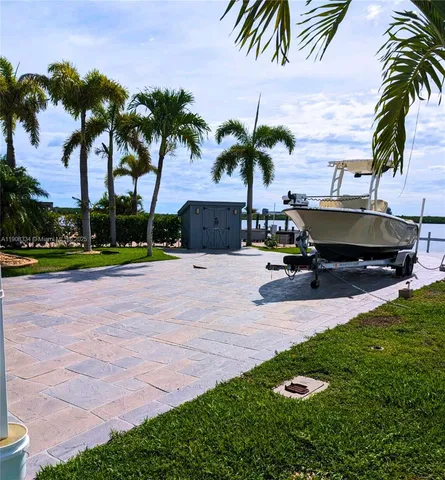 a view of a swimming pool with outdoor seating