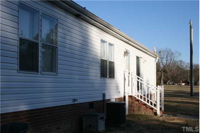 4053 Fairport Road Kittrell, NC 27544 - Photo 11 of 15 Back of the home just begs for a deck to complete this home.