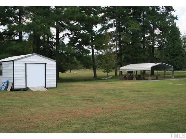 4053 Fairport Road Kittrell, NC 27544 - Photo 14 of 15 Nice storage shed along with the carport help to keep your lawn and equippment organized.