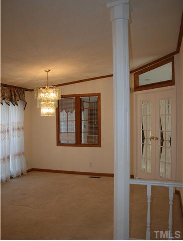 4053 Fairport Road Kittrell, NC 27544 - Photo 2 of 15 Formal room that could be a formal living OR dining room - you choose.