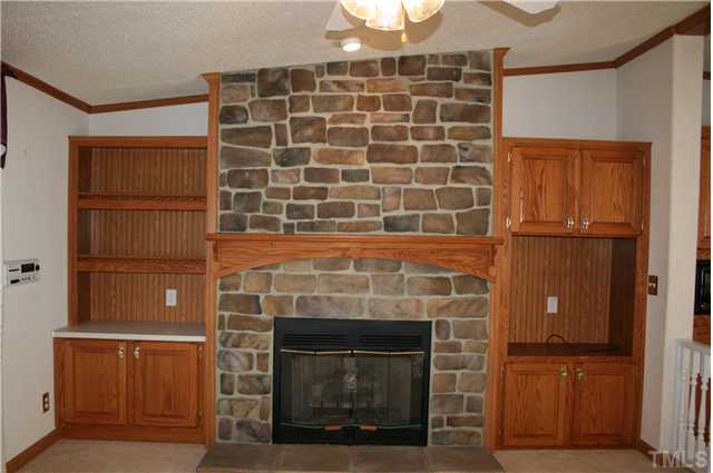 4053 Fairport Road Kittrell, NC 27544 - Photo 7 of 15 A closer look at the gorgeous stone fireplace with gas logs.