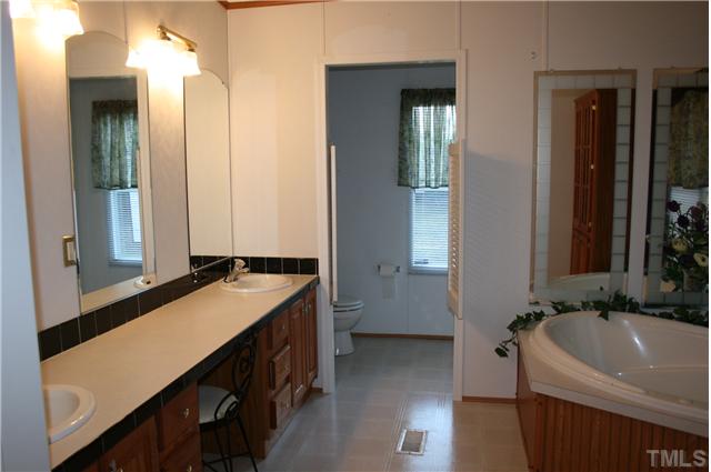 4053 Fairport Road Kittrell, NC 27544 - Photo 9 of 15 Here is the huge master bath to go along with the huge master bedroom. Dual sink vanity witha nice area for putting on makeup, etc.