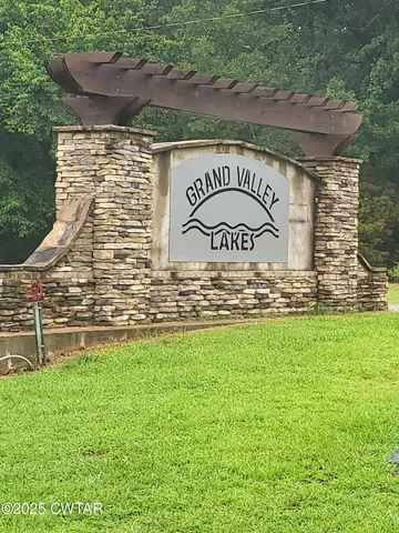 a sign that is on a brick wall