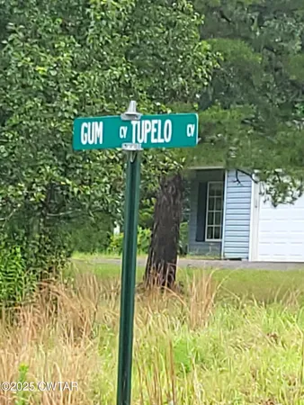 a street sign sitting on the side of a road