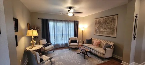 a living room with furniture and a window