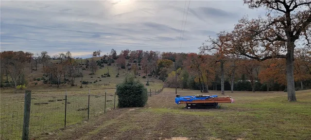 a car parked in the middle of a field