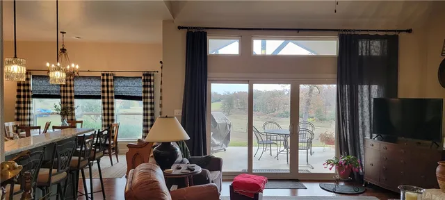 a room with furniture and large windows