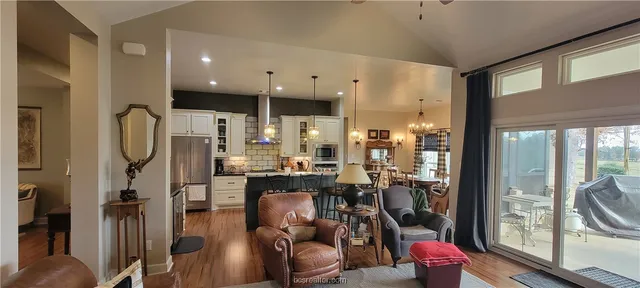 a room with lots of chairs and mirrors