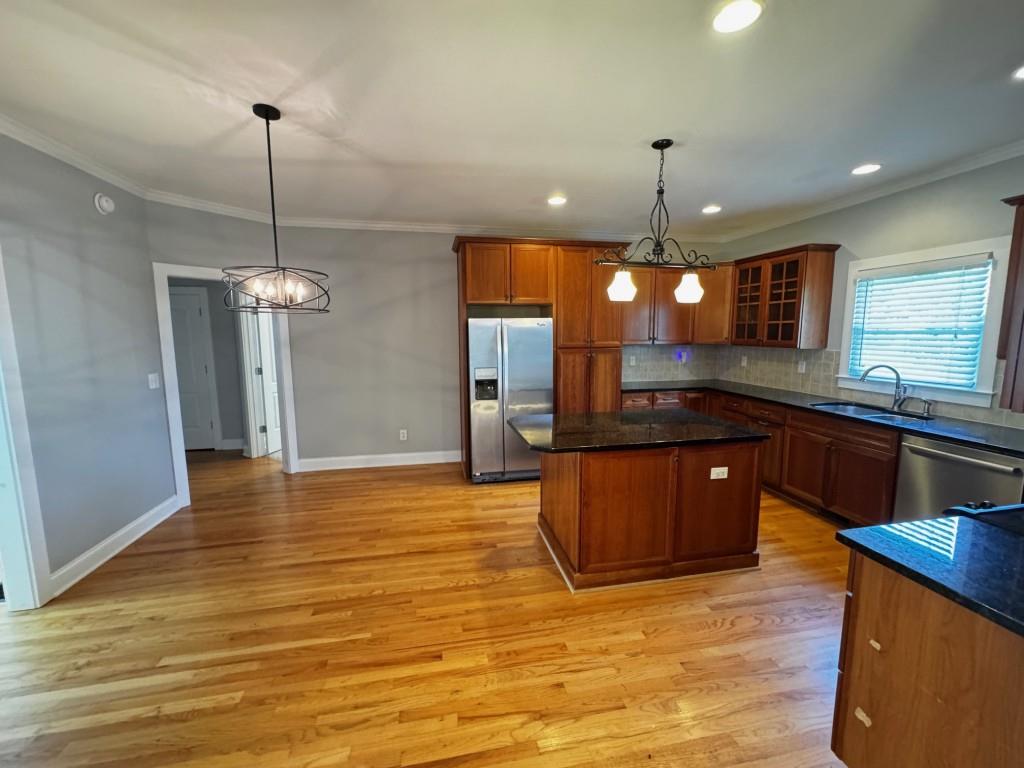 1713 Townside Drive Bishop, GA 30621 - Photo 11 of 25 a kitchen with stainless steel appliances granite countertop a sink refrigerator and cabinets