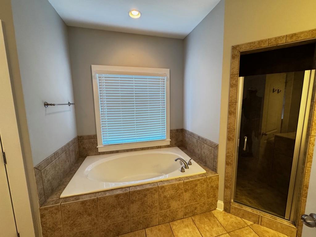 1713 Townside Drive Bishop, GA 30621 - Photo 16 of 25 a bathroom with a bathtub and shower