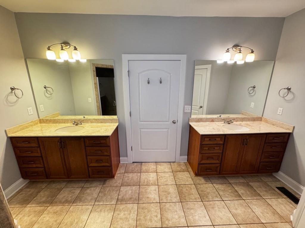 1713 Townside Drive Bishop, GA 30621 - Photo 17 of 25 a bathroom with a sink vanity and a mirror