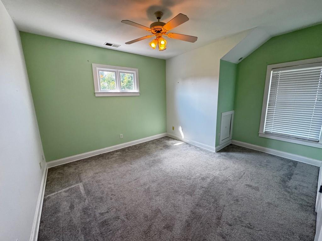 1713 Townside Drive Bishop, GA 30621 - Photo 20 of 25 a view of an empty room with window and a ceiling fan