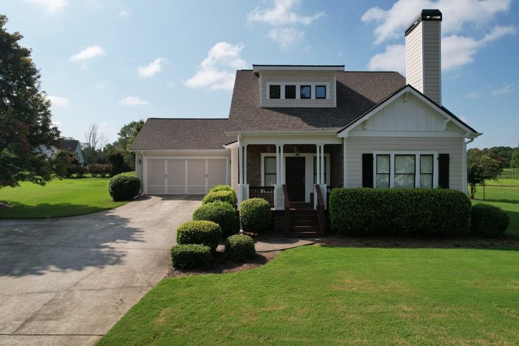 1713 Townside Drive Bishop, GA 30621 - Photo 2 of 25 a front view of a house with a garden