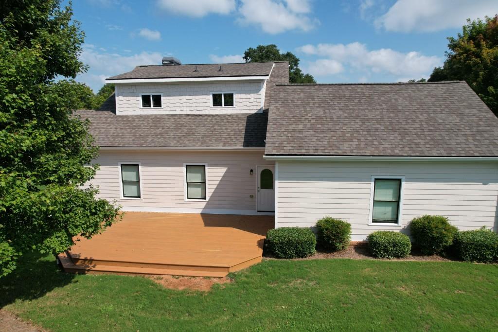 1713 Townside Drive Bishop, GA 30621 - Photo 8 of 25 a front view of a house with a yard and garage