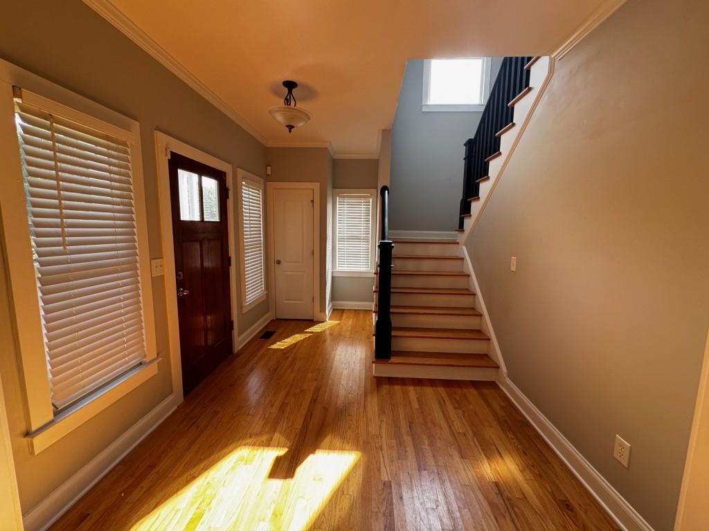 1713 Townside Drive Bishop, GA 30621 - Photo 9 of 25 a view of a hallway with wooden floor and stairs