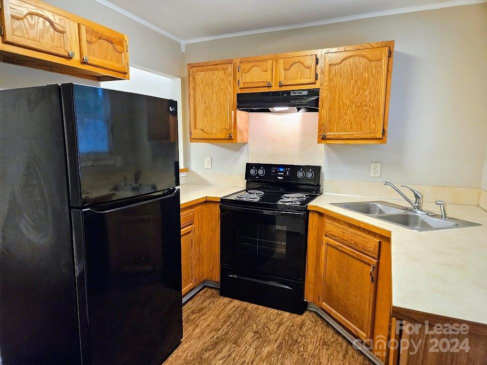 1207 Auten Road, Unit B Charlotte, NC 28216 - Photo 12 of 17 a kitchen with a refrigerator and a sink