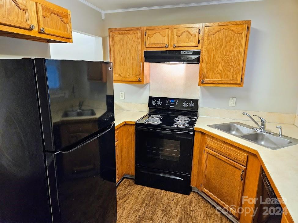 1207 Auten Road, Unit B Charlotte, NC 28216 - Photo 13 of 17 a kitchen with a refrigerator and a sink