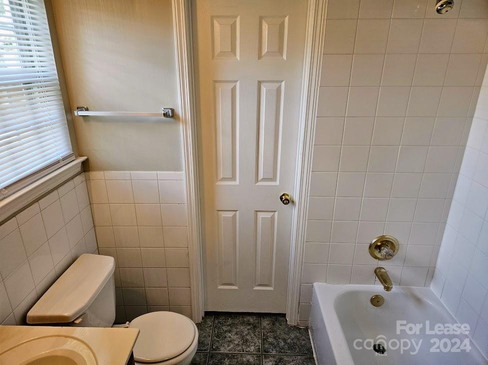 1207 Auten Road, Unit B Charlotte, NC 28216 - Photo 16 of 17 a bathroom with a sink and toilet