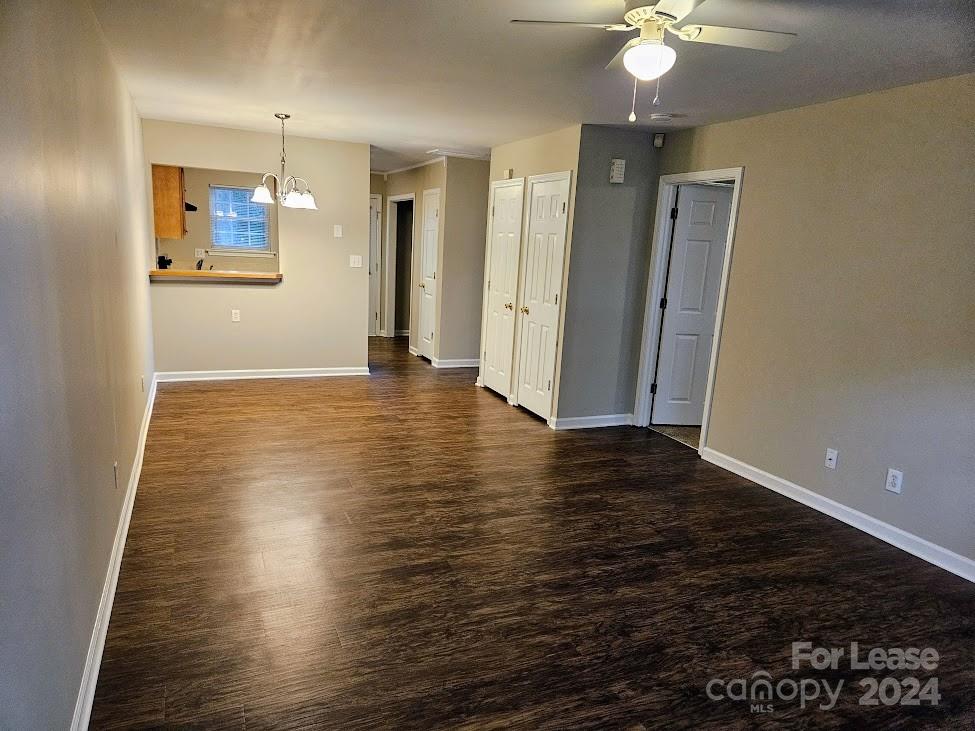 1207 Auten Road, Unit B Charlotte, NC 28216 - Photo 10 of 17 an empty room with wooden floor and windows