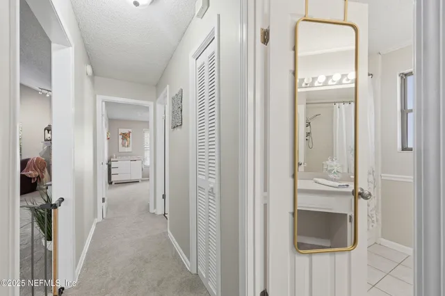 a view of a bathroom from a hallway