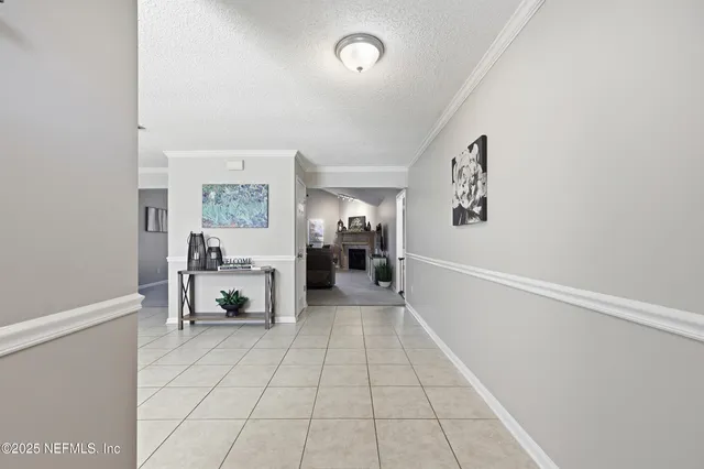 a view of livingroom with furniture and workspace
